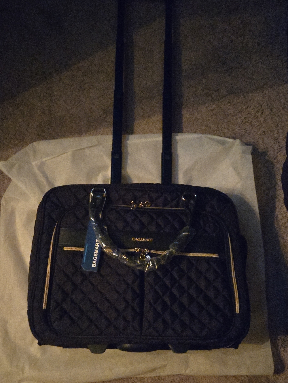 BagSmart Black Quilted Rolling Travel Tote with Gold Accents